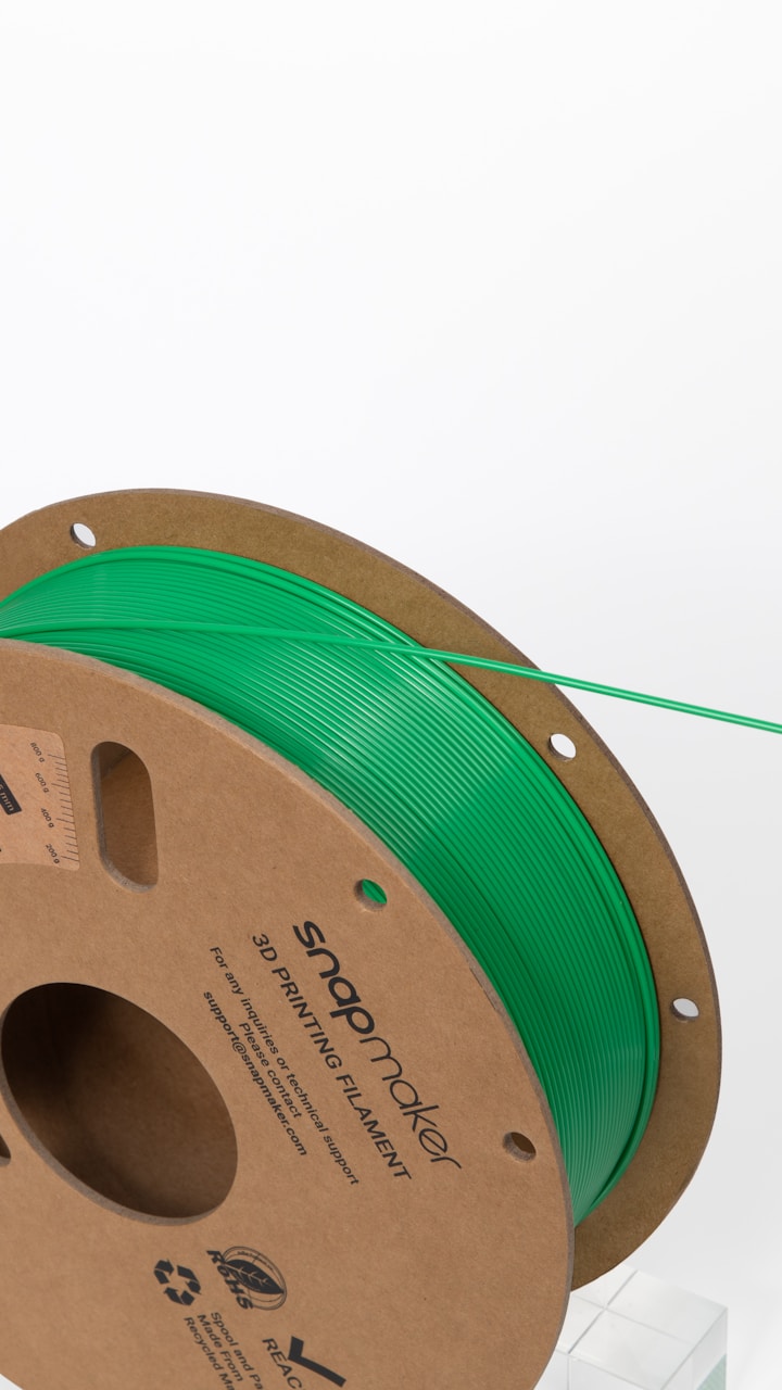 Green 3D printing filament spool ready for compounding into Algae PLA